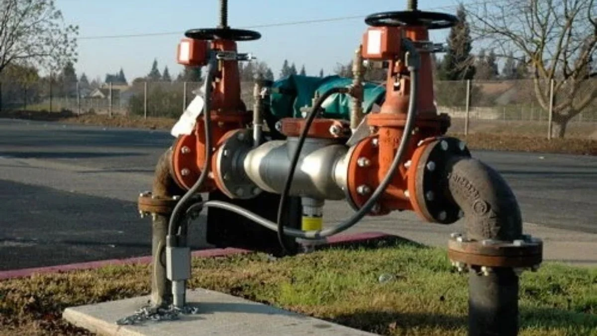 Backflow preventer being tested with a gauge kit